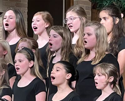 Close view of young singers mid-phrase