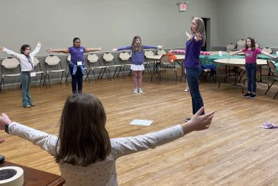 Choir members rehearsing together
