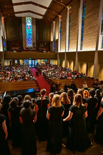 View from behind the choir looking out over a packed sanctuary