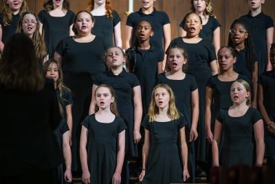 Close view of the youngest choir singing on risers