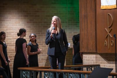 A director speaking to the audience between pieces